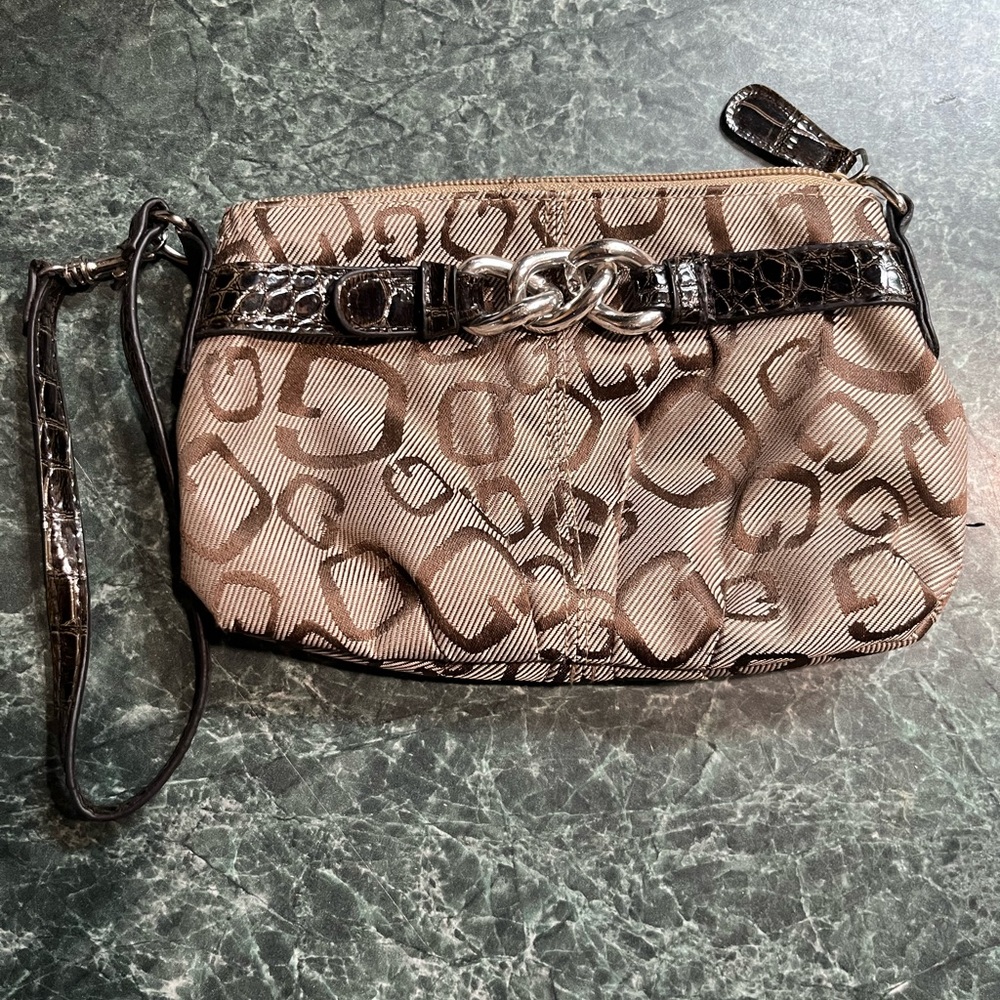 Small wristlet with carrying strap